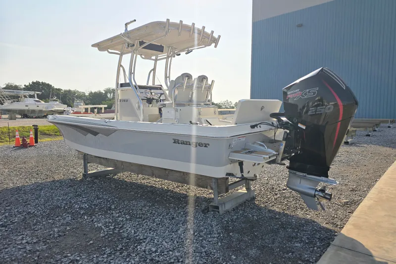 Slide: The Image of 2019 Ranger 2360 Bay Ranger boat with Mercury engine, parked outdoors on gravel. - 4