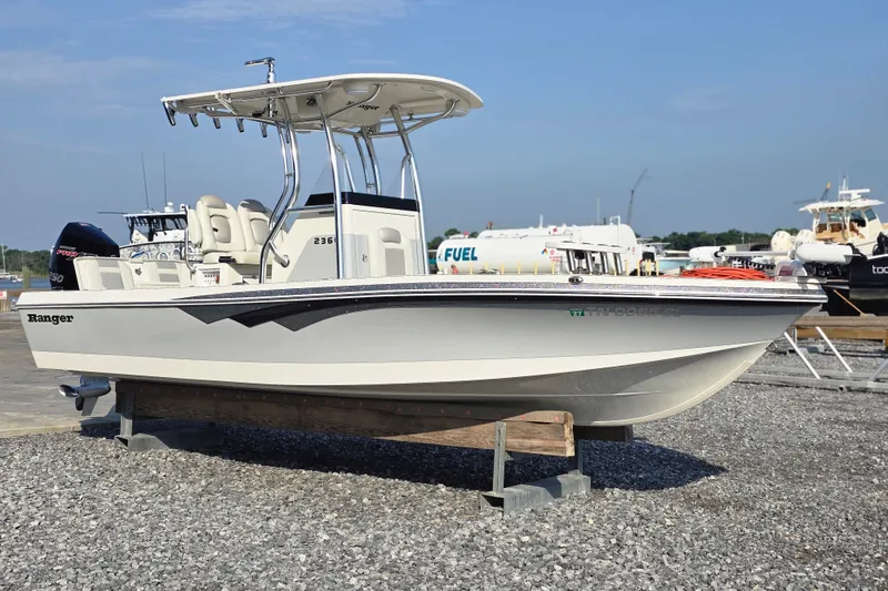 Slide: The Image of 2019 Ranger 2360 Bay Ranger boat on display at a marina. - 6