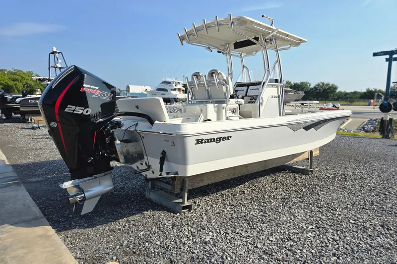 Slide: The Image of 2019 Ranger 2360 Bay Ranger boat with Mercury 250 Pro XS engine on gravel lot. - 5