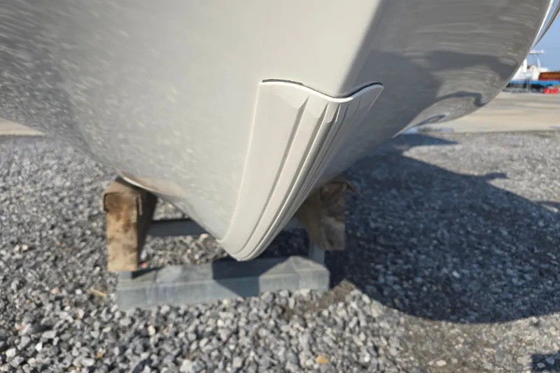 Slide: The Image of 2019 Ranger 2360 Bay Ranger boat hull on gravel, showcasing keel design. - 28