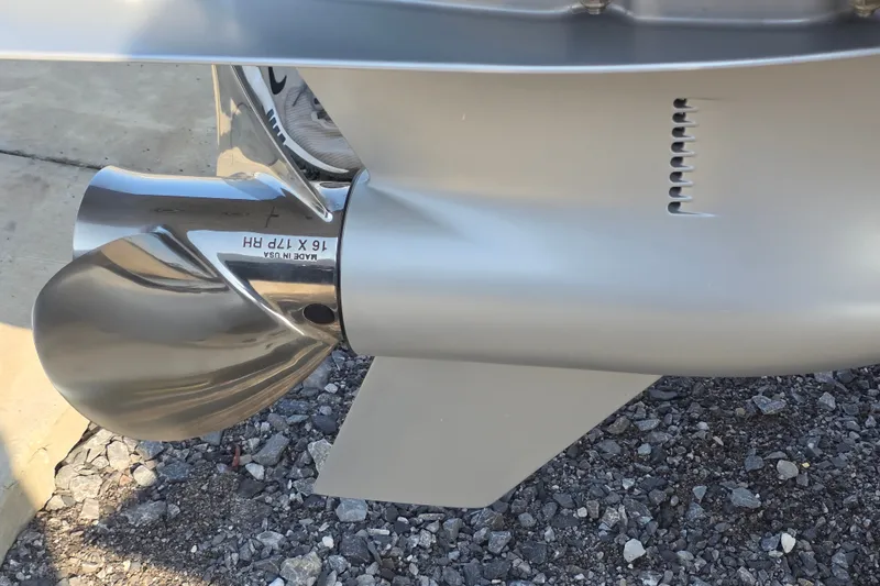 Slide: The Image of Propeller of 2019 Ranger 2360 Bay Ranger boat, stainless steel, on gravel surface. - 12