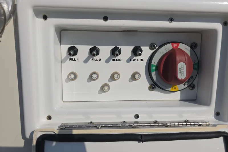 Slide: The Image of Control panel of a 2019 Ranger 2360 Bay Ranger boat with switches and dial. - 31