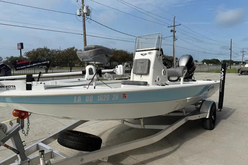 Slide: The Image of 2023 Avid 19 FS boat on trailer, featuring Minn Kota Maxxum motor. - 6