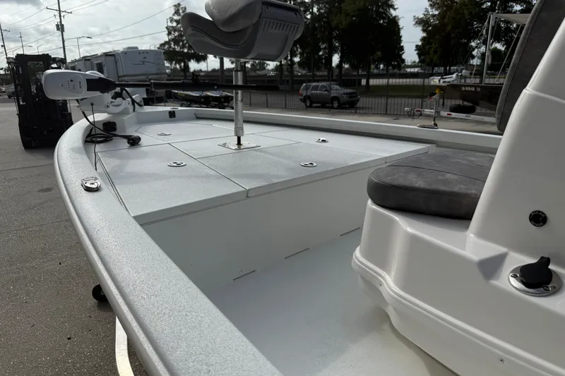 Slide: The Image of 2023 Avid 19 FS boat interior with seating and storage compartments. - 11