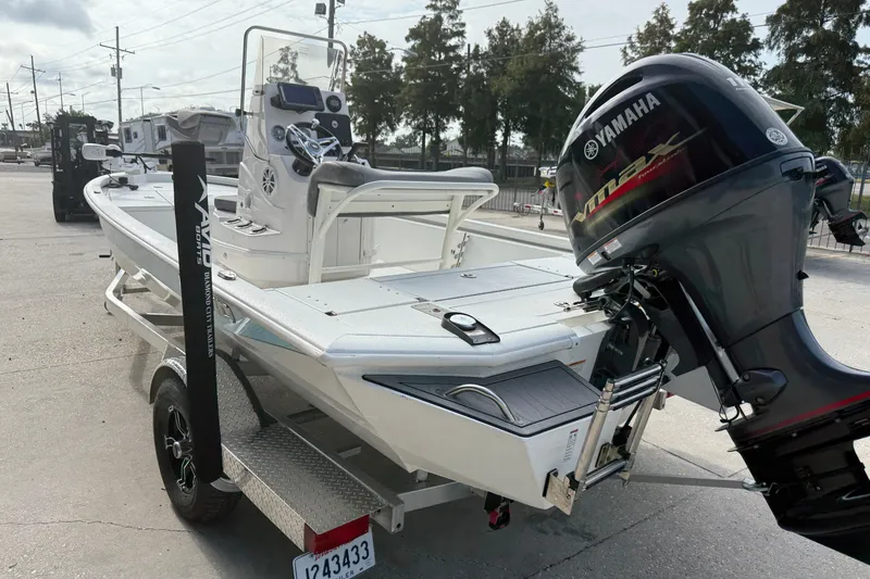 Slide: The Image of 2023 Avid 19 FS boat with Yamaha outboard motor on trailer. - 8