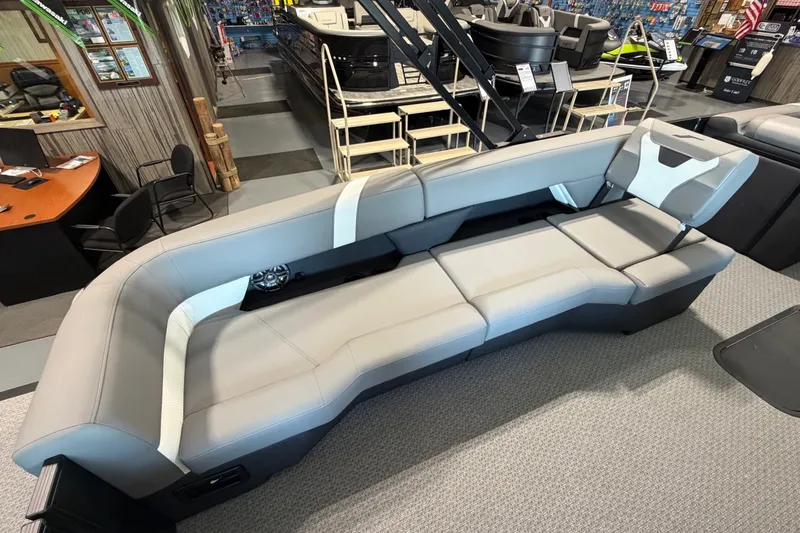 Slide: The Image of Luxurious seating in a 2027 Evotti 521QL boat showroom display. - 17