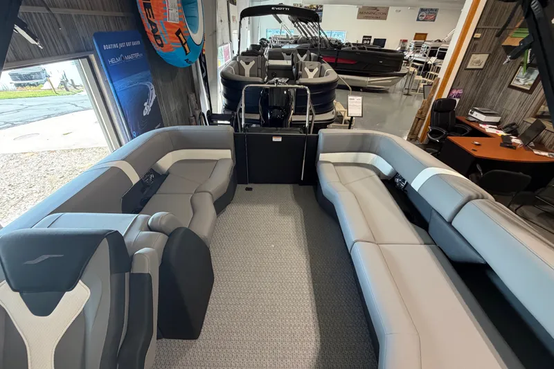 Slide: The Image of Interior of 2027 Evotti 521QL pontoon boat with gray seating in showroom. - 16