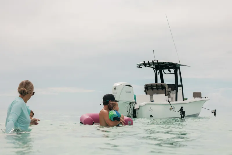 Slide: The Image of Family enjoying water near 2027 Sea Hunt BX25FS boat. - 37