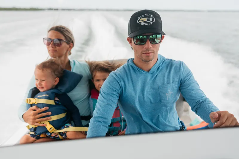Slide: The Image of Family enjoying a ride on a 2027 Sea Hunt BX25FS boat. - 41