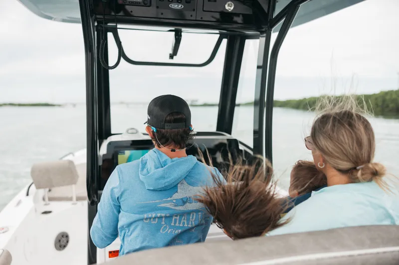 Slide: The Image of Family enjoying a ride on a 2027 Sea Hunt BX25FS boat. - 40