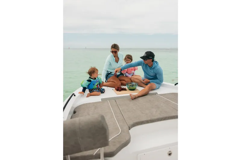 Slide: The Image of Family enjoying a picnic on a 2027 Sea Hunt BX25FS boat. - 39
