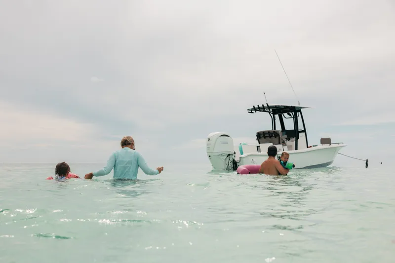 Slide: The Image of Family enjoying water near 2027 Sea Hunt BX25FS boat. - 36