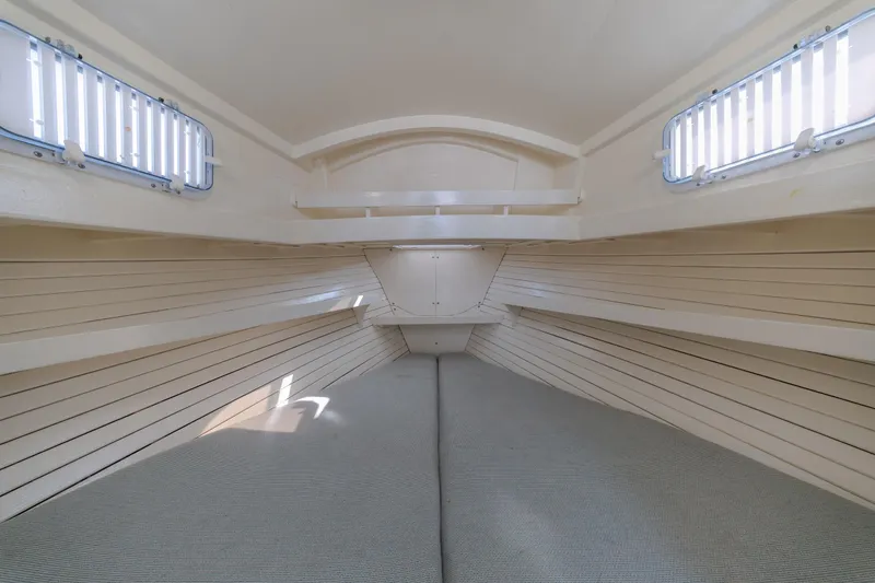 Slide: The Image of Interior of a 1958 Albury Brothers boat cabin with wooden paneling and windows. - 75