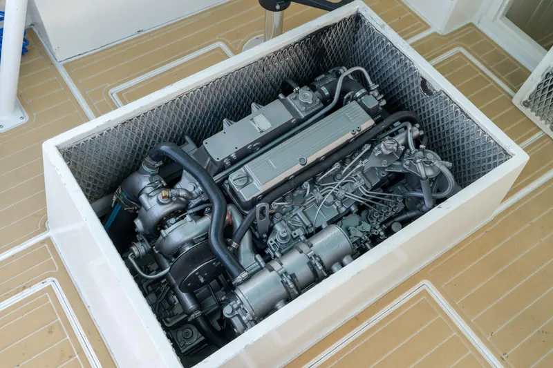 Slide: The Image of 1958 Albury Brothers boat engine in compartment, showcasing intricate mechanical details. - 68