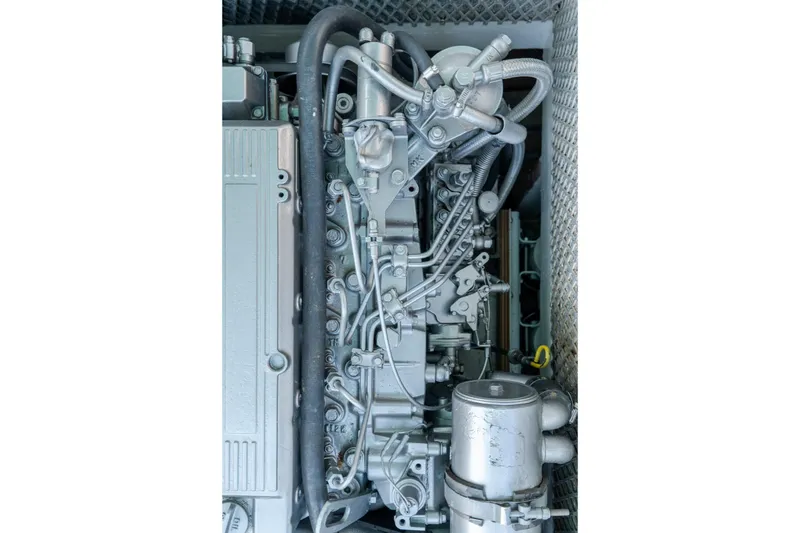 Slide: The Image of Close-up of a 1958 Albury Brothers engine with intricate piping and components. - 69