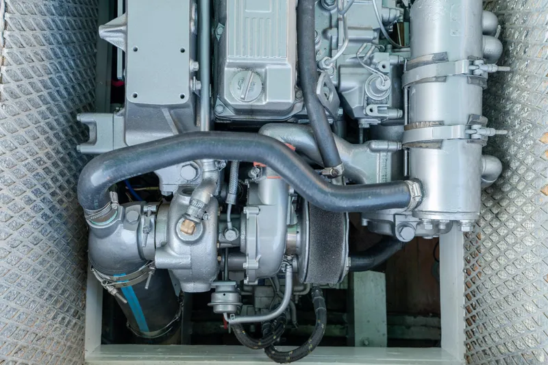 Slide: The Image of 1958 Albury Brothers engine with intricate piping and metallic components. - 70
