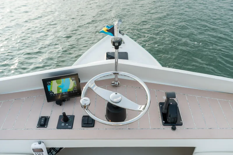 Slide: The Image of 1958 Albury Brothers boat helm with navigation equipment on calm water. - 85
