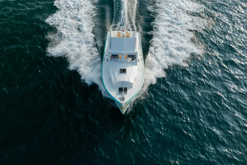 Slide: The Image of Aerial view of a 1958 Albury Brothers boat cruising through ocean waves. - 32