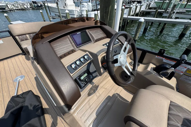 Slide: The Image of Helm of 2022 Bennington 23 LXFB boat with steering wheel and control panel. - 15