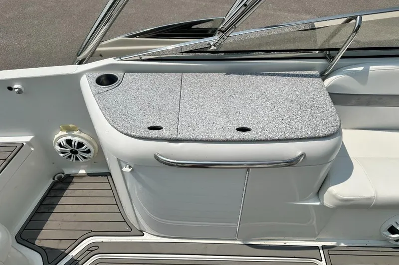 Slide: The Image of 2004 Formula 260 Bowrider interior with seating and storage area. - 8