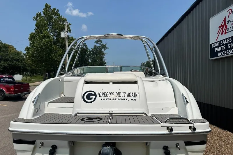 Slide: The Image of 2004 Formula 260 Bowrider boat at marina, rear view with custom text. - 4