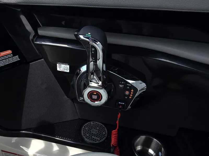 Slide: The Image of Close-up of the throttle control on a 2025 Sea Ray SLX 260 Surf boat. - 16