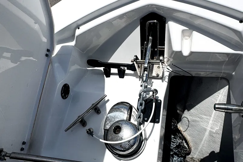 Slide: The Image of 2024 Blackfin 272 DC boat anchor system with chain and winch in storage compartment. - 12