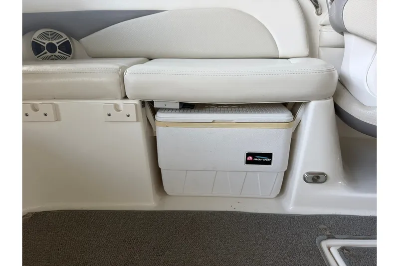 Slide: The Image of 2008 Chaparral 256 SSi boat interior with built-in cooler and speaker. - 57