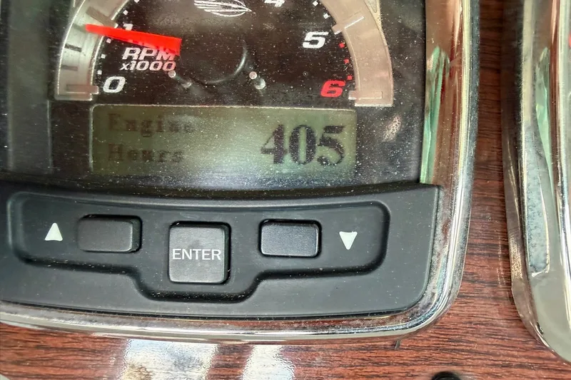 Slide: The Image of Dashboard of 2008 Chaparral 256 SSi showing 405 engine hours. - 55