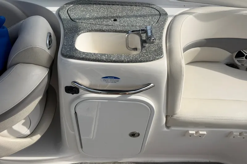 Slide: The Image of 2008 Chaparral 256 SSi boat interior with sink and seating area. - 41