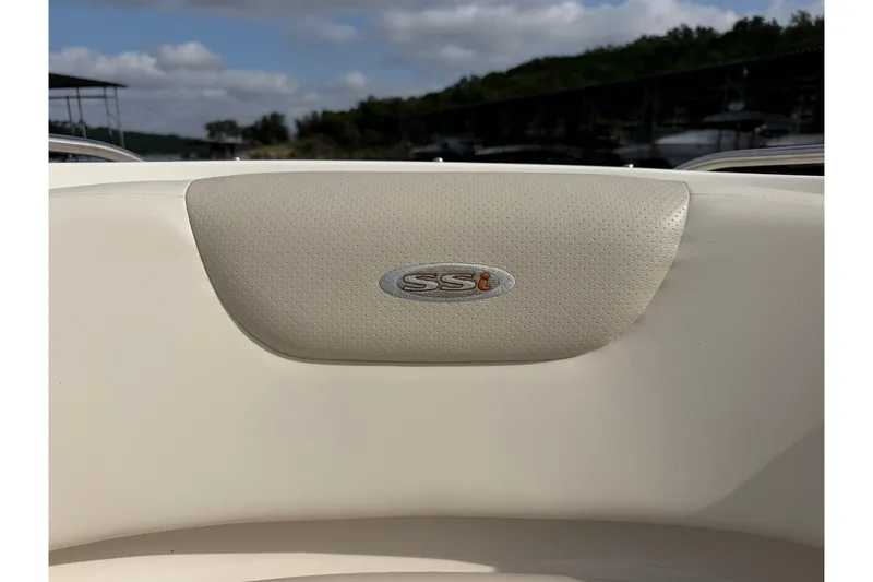Slide: The Image of 2008 Chaparral 256 SSi boat seat with logo, outdoor setting. - 64
