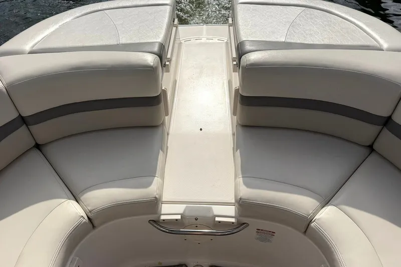 Slide: The Image of 2008 Chaparral 256 SSi boat interior with cushioned seating and sleek design. - 32