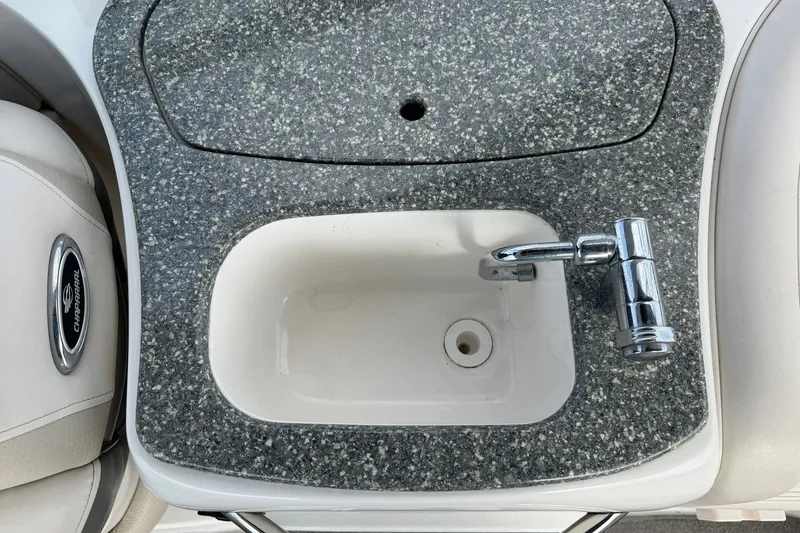 Slide: The Image of 2008 Chaparral 256 SSi boat sink with granite countertop and chrome faucet. - 42