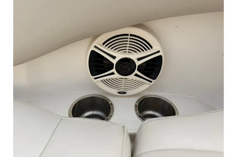 Slide: The Image of Speaker and cup holders on 2008 Chaparral 256 SSi boat interior. - 60