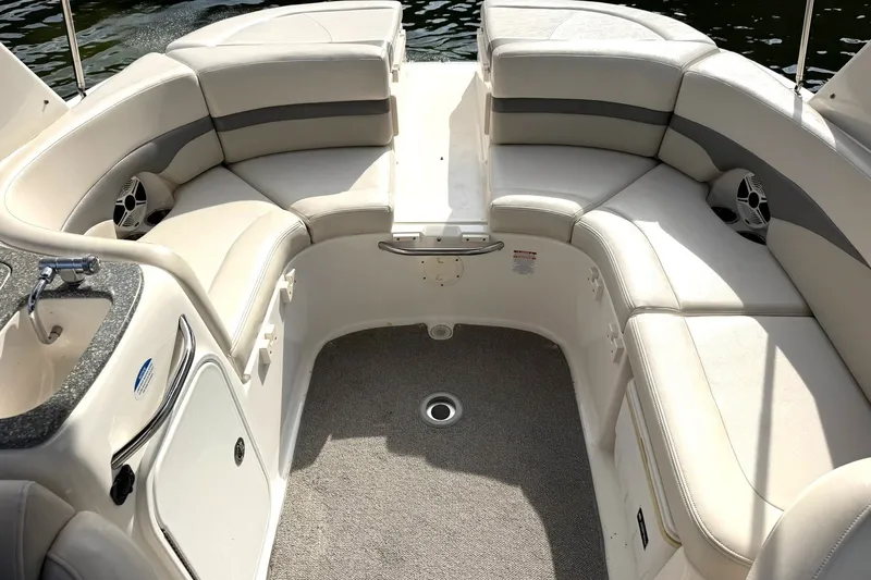 Slide: The Image of 2008 Chaparral 256 SSi boat interior with plush seating and built-in sink. - 5