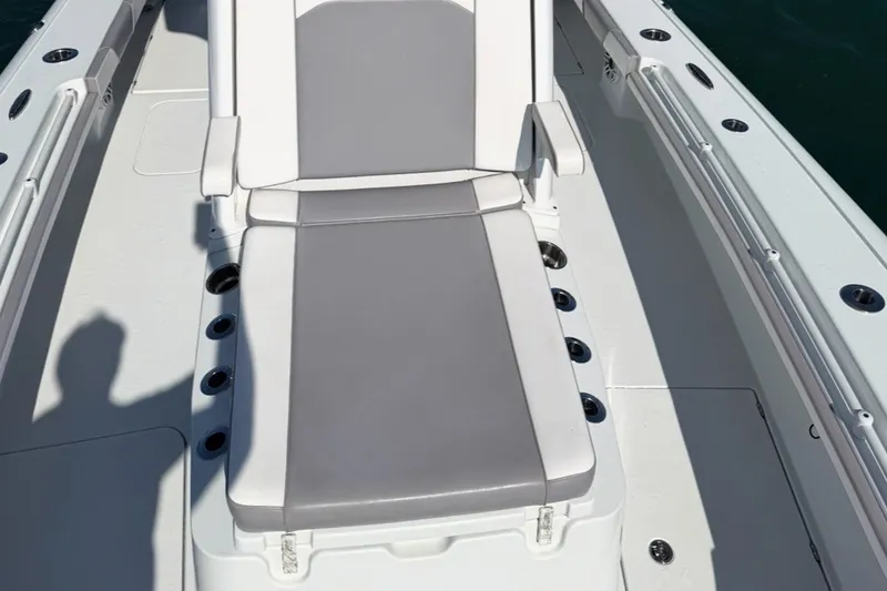 Slide: The Image of 2024 Costa Custom Boats 264HC interior with gray and white seating on deck. - 15