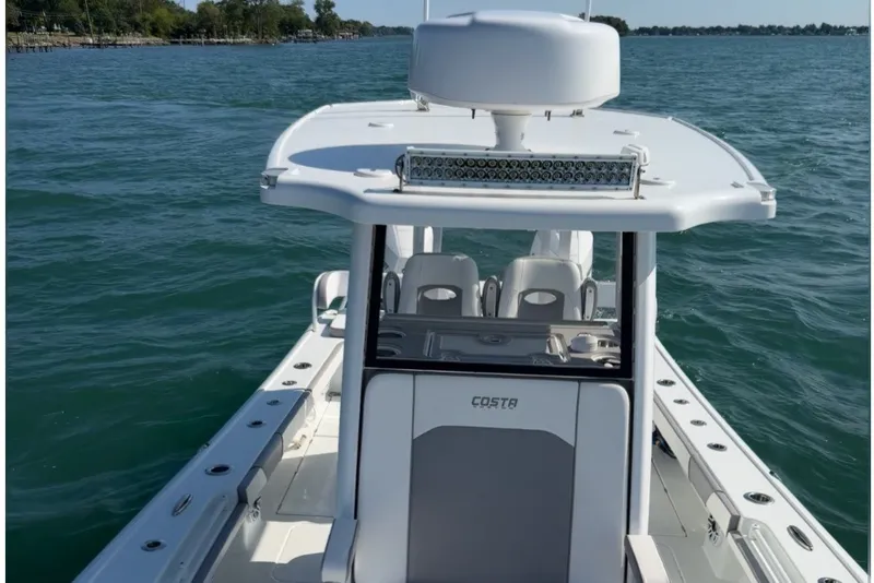 Slide: The Image of 2024 Costa Custom Boats 264HC on water, showcasing sleek design and modern features. - 14