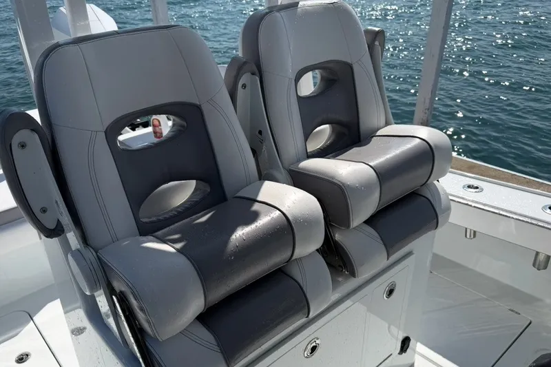 Slide: The Image of 2024 Costa Custom Boats 264HC seats with ocean backdrop, showcasing luxury marine design. - 17