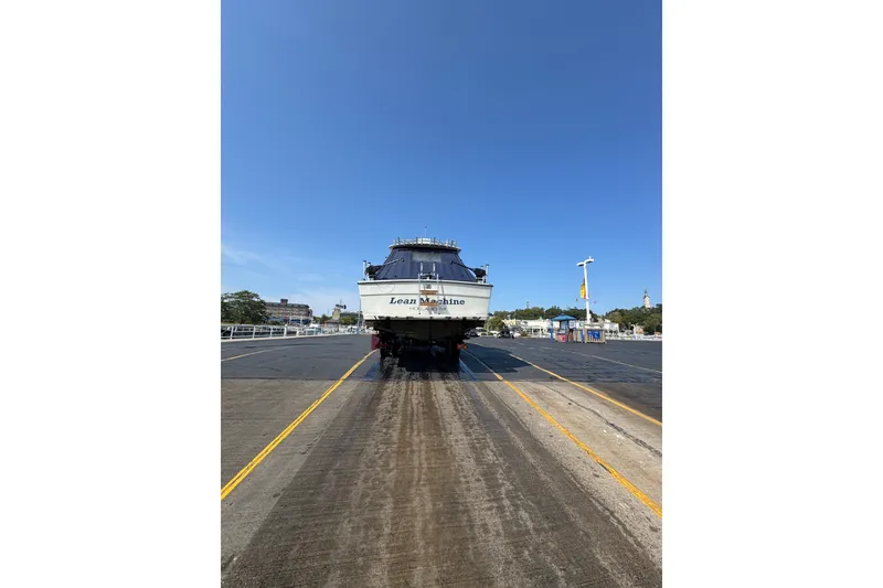 Slide: The Image of 1986 Tiara Yachts 3100 Open on dry dock under clear blue sky. - 1
