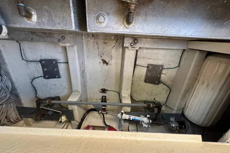 Slide: The Image of Engine compartment of a 1986 Tiara Yachts 3100 Open, showcasing mechanical components. - 18