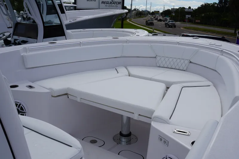 Slide: The Image of 2027 Sportsman Heritage 261 Center Console boat with spacious white seating area. - 20