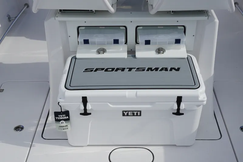Slide: The Image of YETI cooler on 2027 Sportsman Heritage 261 Center Console boat deck. - 9