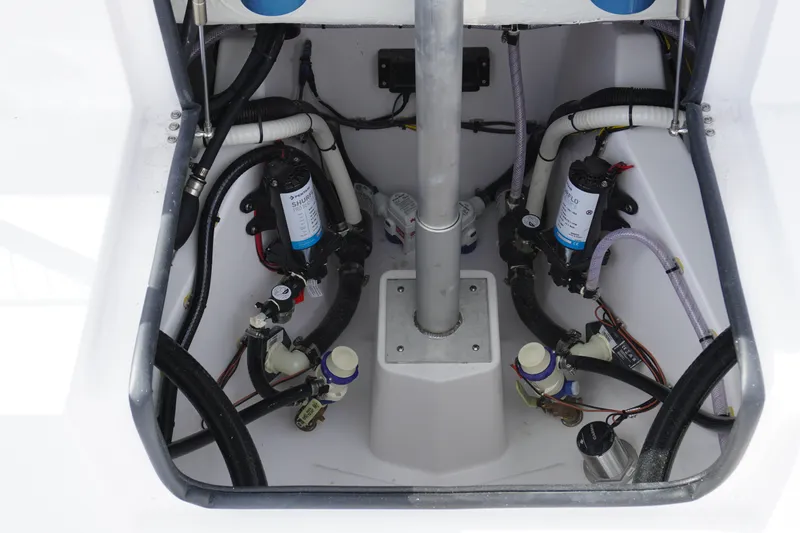 Slide: The Image of 2027 Sportsman Heritage 261 Center Console boat interior wiring and plumbing system. - 7