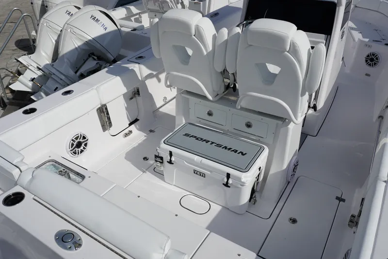 Slide: The Image of 2027 Sportsman Heritage 261 Center Console boat interior with Yamaha engines and seating. - 3