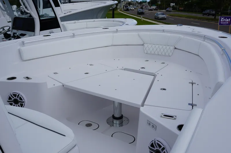 Slide: The Image of 2027 Sportsman Heritage 261 Center Console boat interior with seating and table. - 19