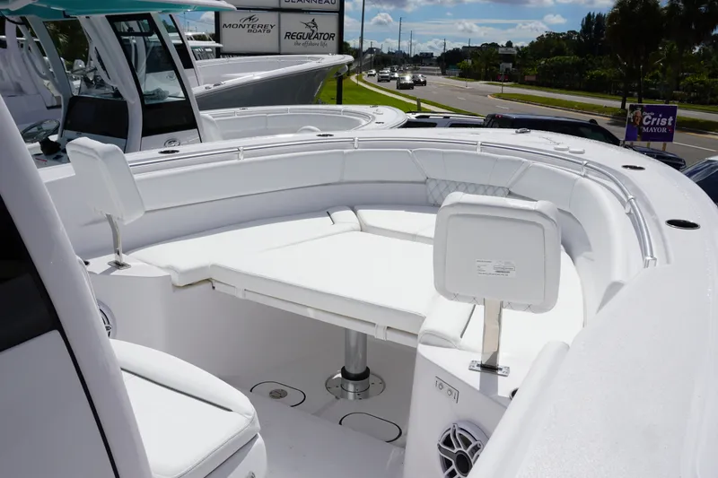 Slide: The Image of 2027 Sportsman Heritage 261 Center Console boat with spacious seating and modern design. - 21