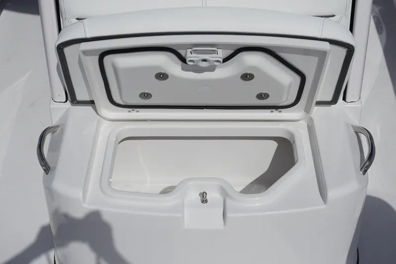 Slide: The Image of Open storage compartment on 2027 Sportsman Heritage 261 Center Console boat. - 25