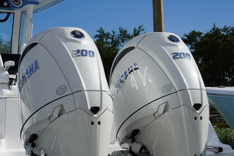 Slide: The Image of Twin Yamaha 200 engines on a 2027 Sportsman Heritage 261 Center Console boat. - 1