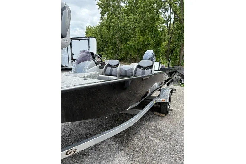 Slide: The Image of 2020 G3 Sportsman 1710 boat on trailer, parked outdoors near trees. - 3