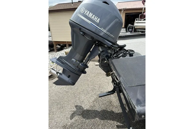 Slide: The Image of 2020 G3 Sportsman 1710 boat with Yamaha outboard motor, parked outdoors. - 11